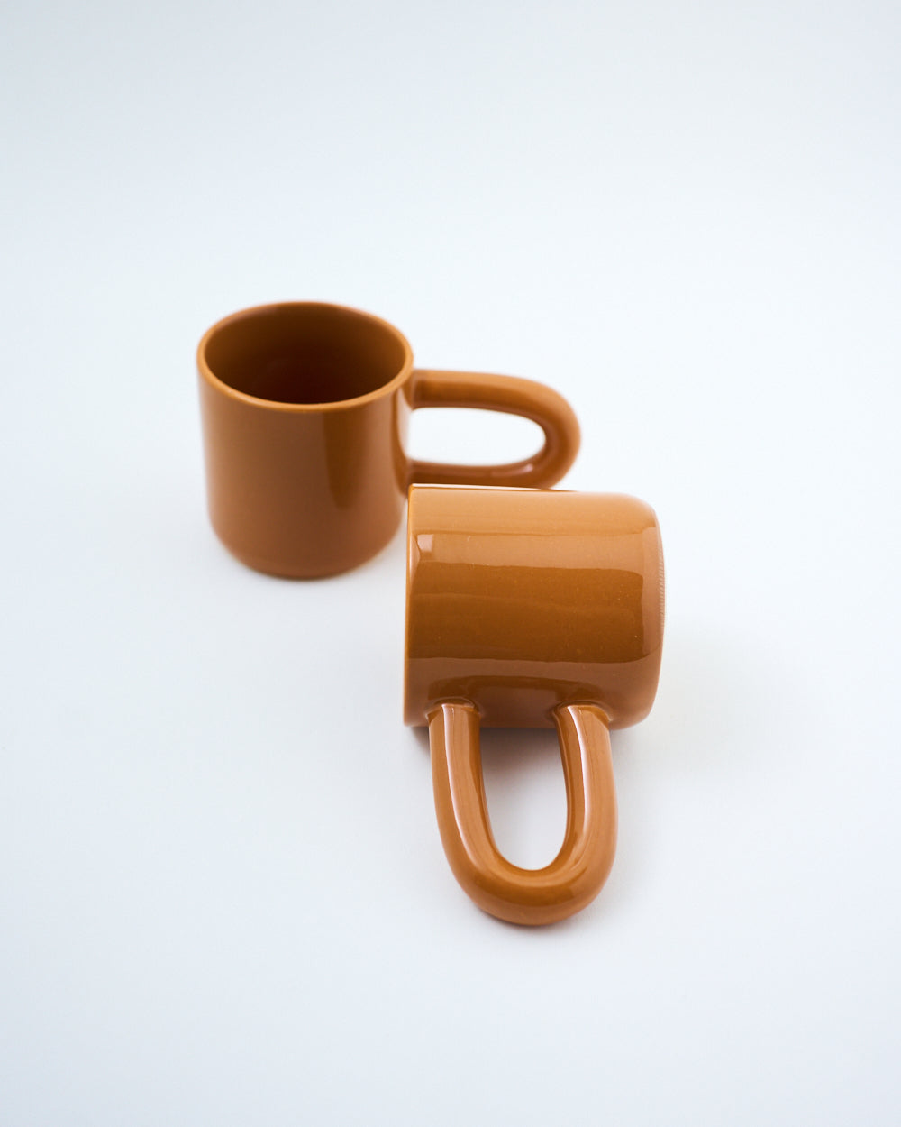 brown long handle coffee mug stoneware