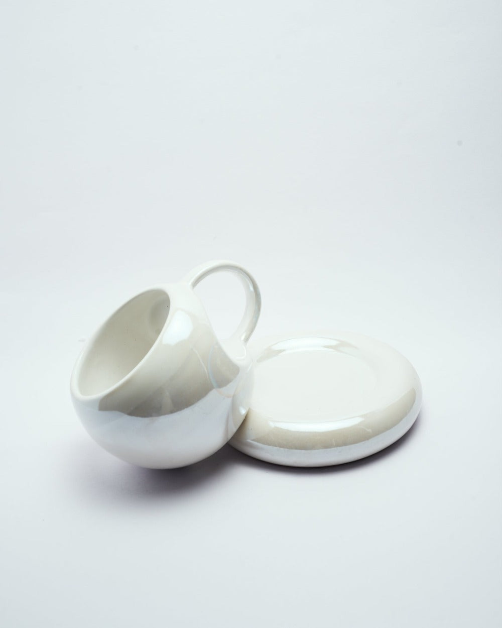 cavity coffee mug and saucer set chrome edition