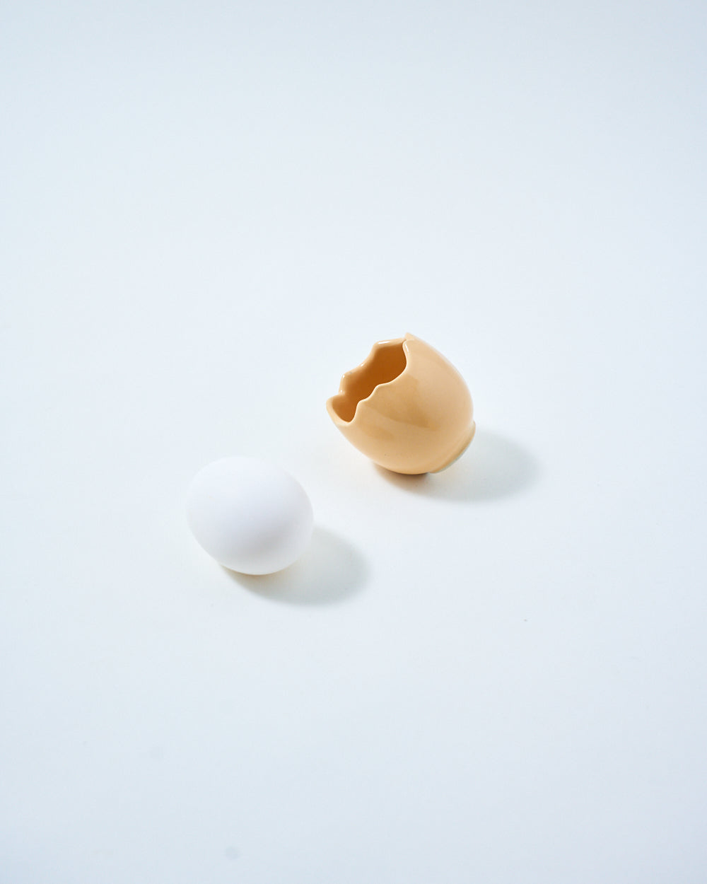 beige ceramic egg holder