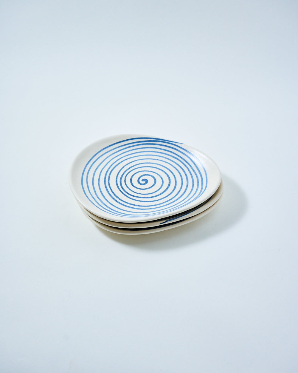 serving tray with a hand drawn spiral effect