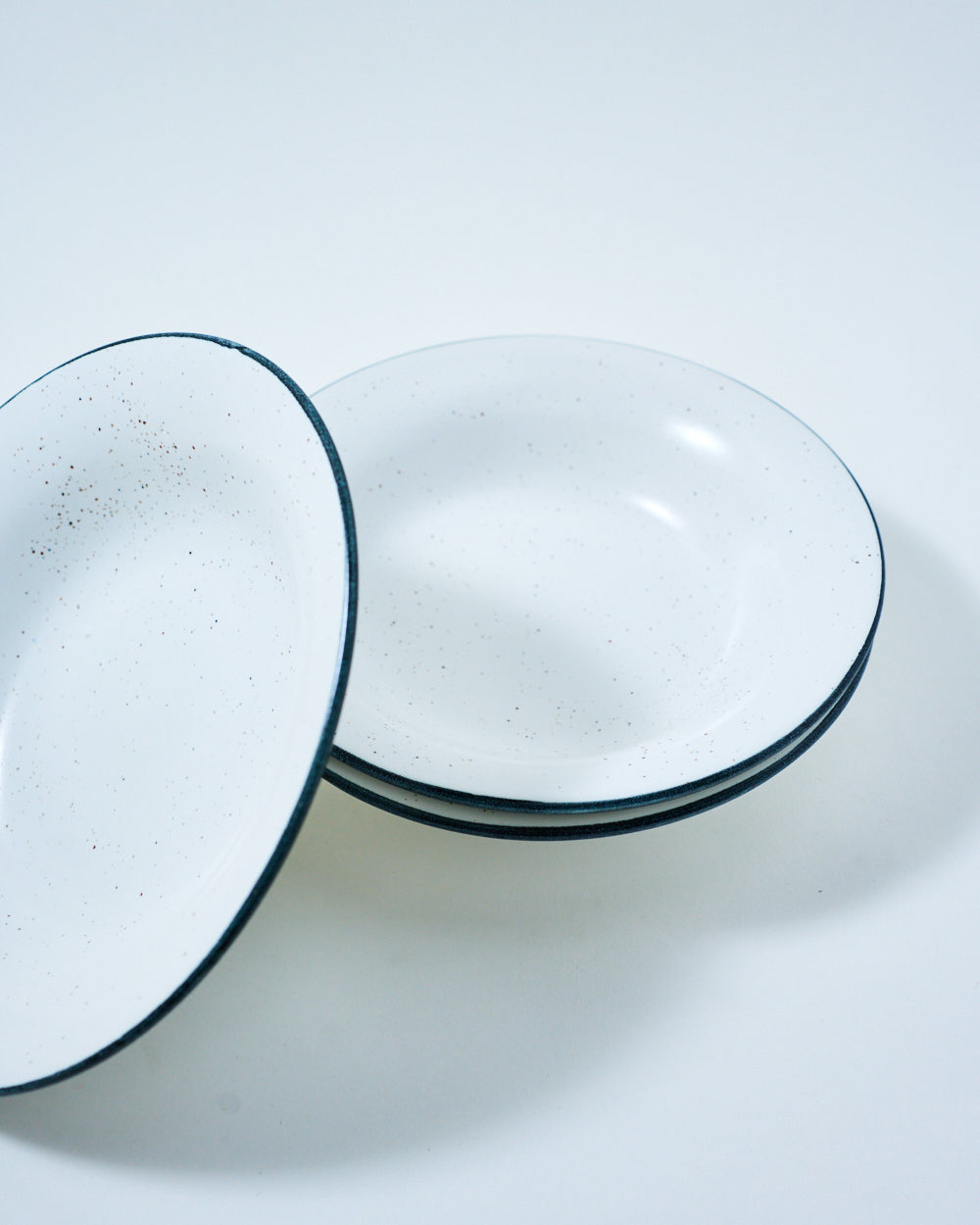 stoneware white deep plate with black rim
