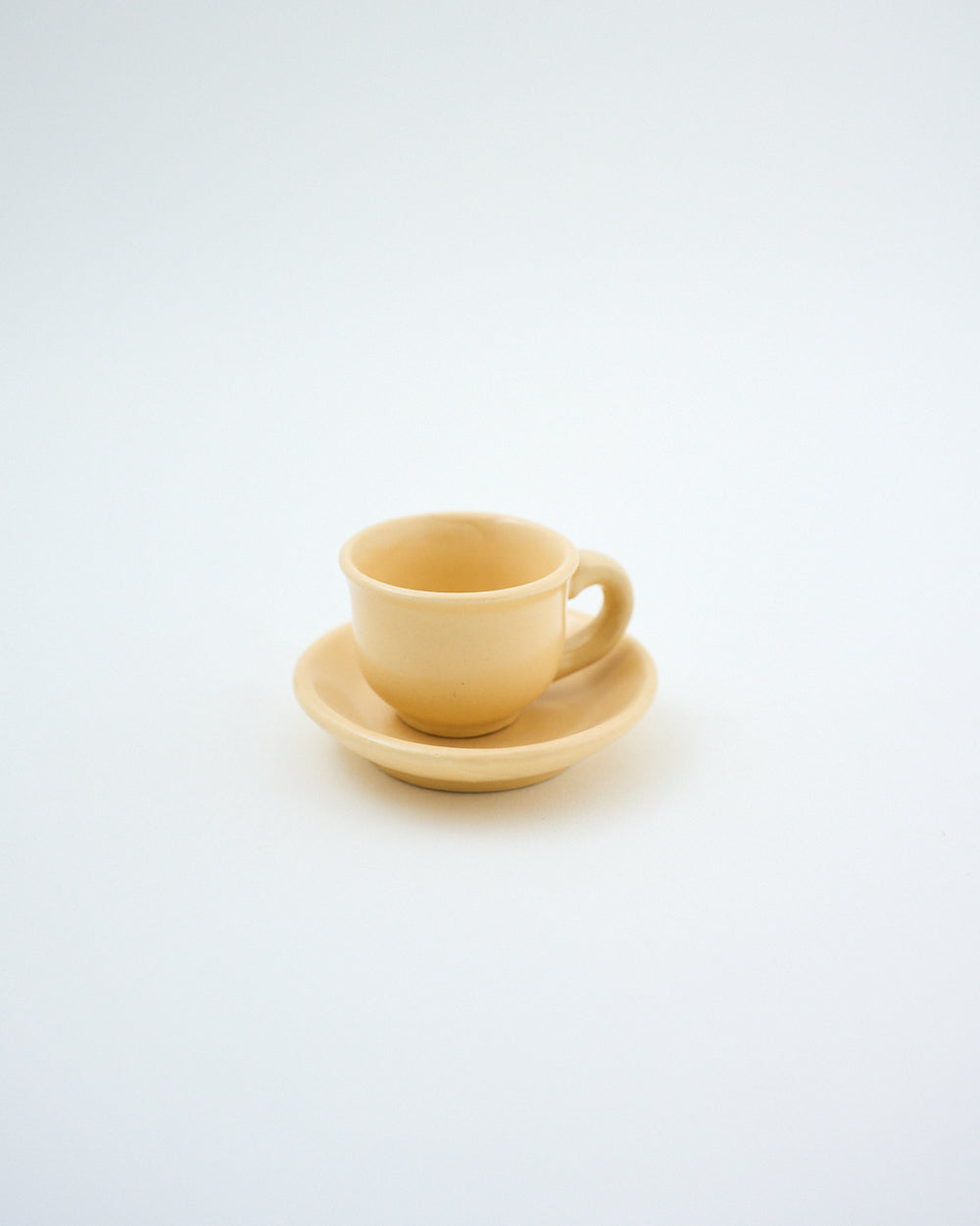 tiny cup and saucer beige