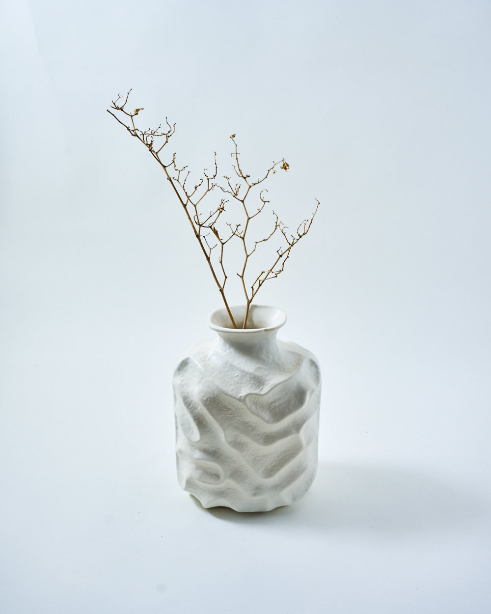 white vase with branch