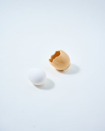 beige ceramic egg holder