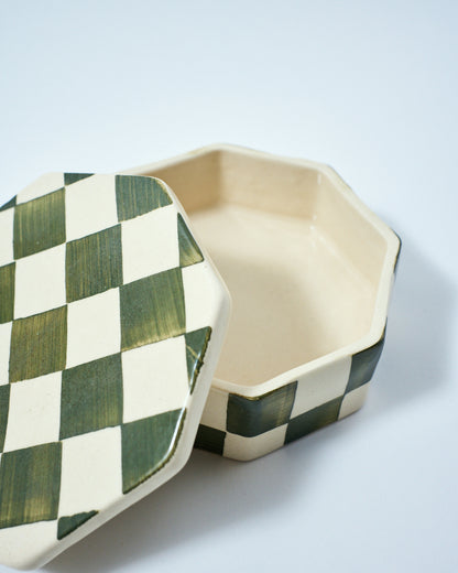 checkered ceramic container with a lid