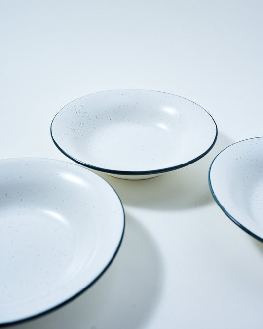 deep plate speckled white with a rim